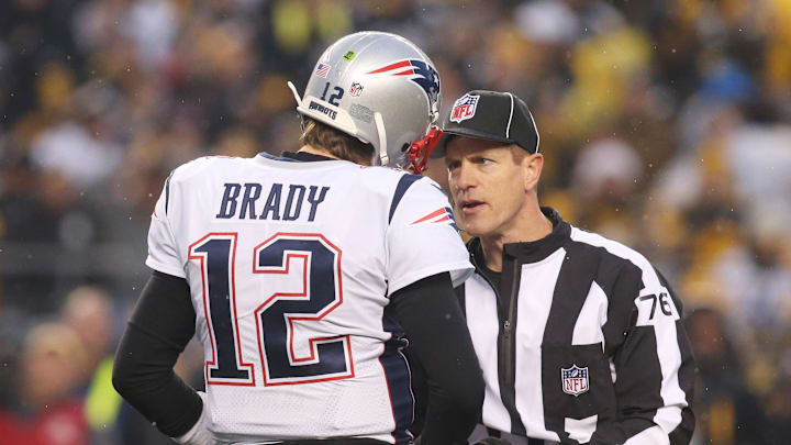 Dec 17, 2017; Pittsburgh, PA, USA;  New England Patriots quarterback Tom Brady (12) talks to side judge Alan Eck (76) against the Pittsburgh Steelers during the first quarter at Heinz Field. New England won 27-24. Mandatory Credit: Charles LeClaire-Imagn Images