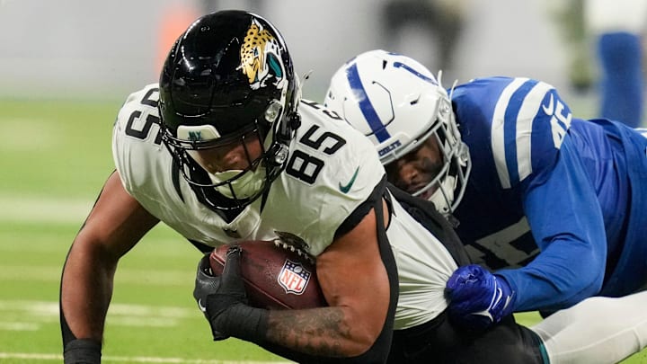 Indianapolis Colts linebacker E.J. Speed (45) tackles Jacksonville Jaguars tight end Brenton Strange (85) during the game at Lucas Oil Stadium.