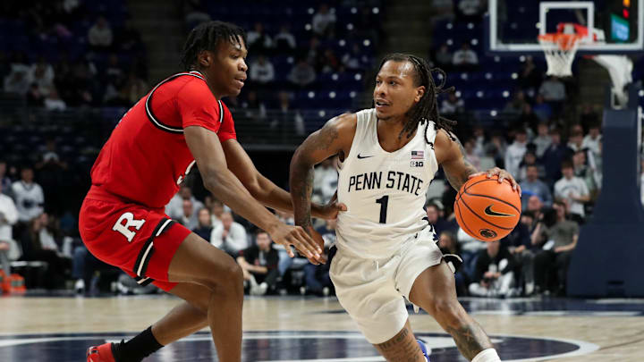 Jan 20, 2025; University Park, Pennsylvania, USA; Penn State Nittany Lions guard Ace Baldwin Jr (1) dribbles the ball around the outside of Rutgers Scarlet Knights forward Dylan Grant (9) during the first half at Bryce Jordan Center. Penn State defeated Rutgers 80-72. Mandatory Credit: Matthew O'Haren-Imagn Images