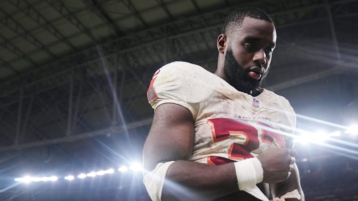 Arizona Cardinals running back Trey Benson (33) walks off the field after their 23-20 loss to the Seattle Seahawks at State Farm Stadium in Glendale on Sept. 25, 2025.