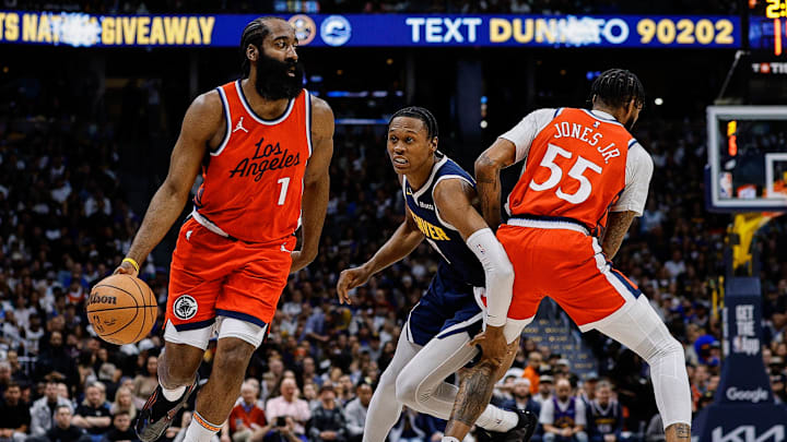 Apr 21, 2025; Denver, Colorado, USA; Los Angeles Clippers guard James Harden (1) controls the ball as forward Derrick Jones Jr. (55) screens against Denver Nuggets forward Peyton Watson (8) in the first quarter during game two of first round for the 2025 NBA Playoffs at Ball Arena. Mandatory Credit: Isaiah J. Downing-Imagn Images