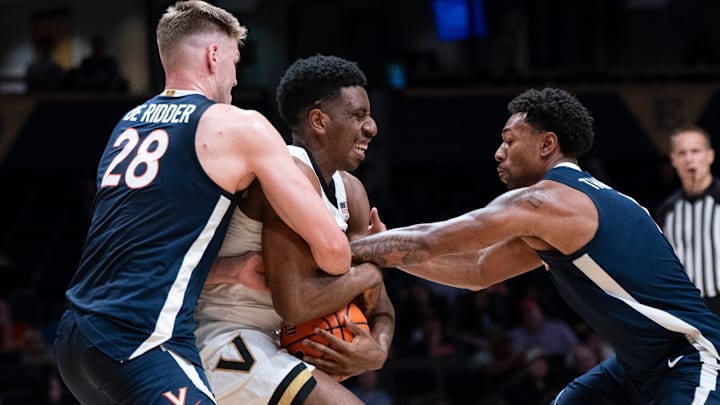 Virginia forward Thijs De Ridder (28) and guard Malik Thomas (1) trap Vanderbilt forward AK Okereke (10) during the second half of their exhibition game at Memorial Gym in Nashville, Tenn., Thursday, Oct. 16, 2025. Virginia forward Thijs De Ridder (28) and guard Malik Thomas (1) trap Vanderbilt forward AK Okereke (10) during the second half of their exhibition game at Memorial Gym in Nashville, Tenn., Thursday, Oct. 16, 2025.