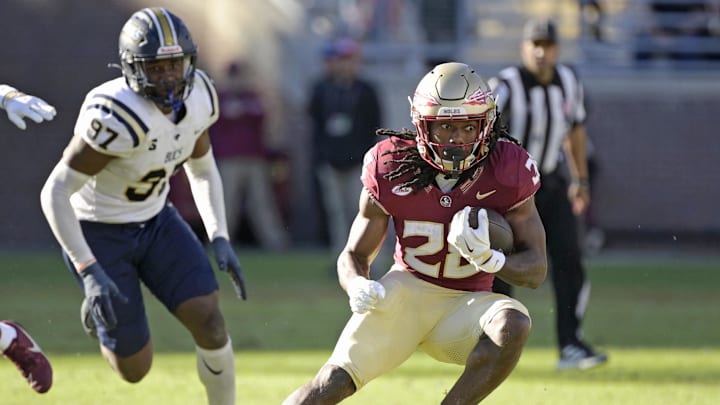 Nov 23, 2024; Tallahassee, Florida, USA; Florida State Seminoles running back Samuel Singleton Jr. (28) runs the ball against the Charleston Southern Buccaneers during the second half at Doak S. Campbell Stadium. Mandatory Credit: Melina Myers-Imagn Images