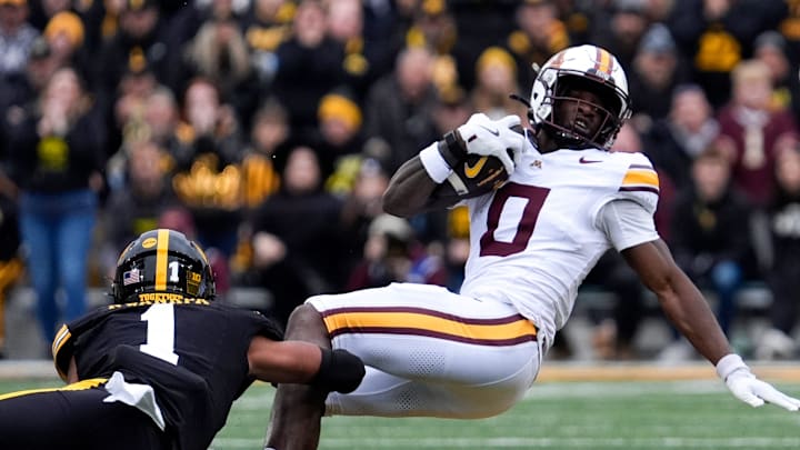 Iowa Hawkeyes wide receiver Kj Parker (1) tackles Minnesota Golden Gophers wide receiver Lemeke Brockington (0) Oct. 25, 2025 at Kinnick Stadium in Iowa City, Iowa.