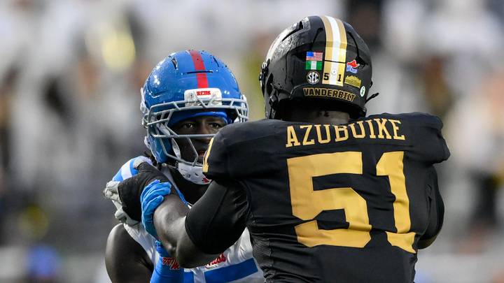 Oct 10, 2026; Nashville, Tennessee, USA;  Vanderbilt Commodores offensive lineman Clinton Azubuike (51) \blocks Mississippi Rebels defensive end Landon Barnes (15) during the second half at FirstBank Stadium.  Mandatory Credit: Steve Roberts-Imagn Images
