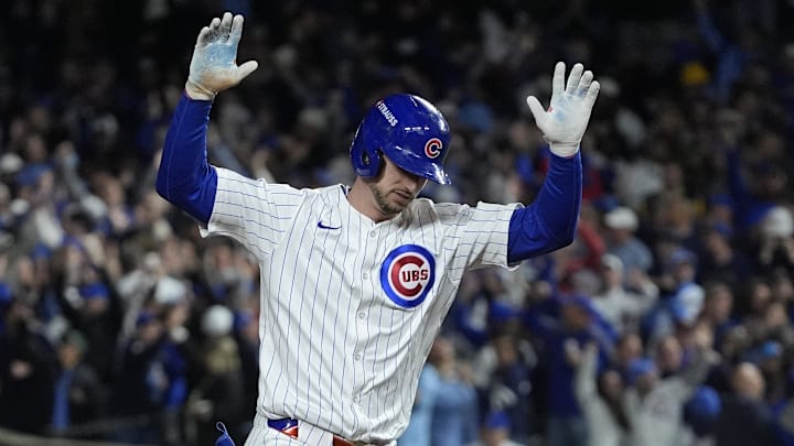 Kyle Tucker of Chicago Cubs raises arms rounding bases after home run Kyle Tucker of Chicago Cubs raises arms rounding bases after home run