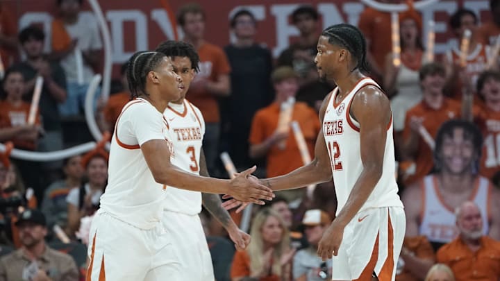Texas Longhorns guard Simeon Wilcher is congratulated by guard Tramon Mark during the second half against the Lafayette Leopards at Moody Center. 
