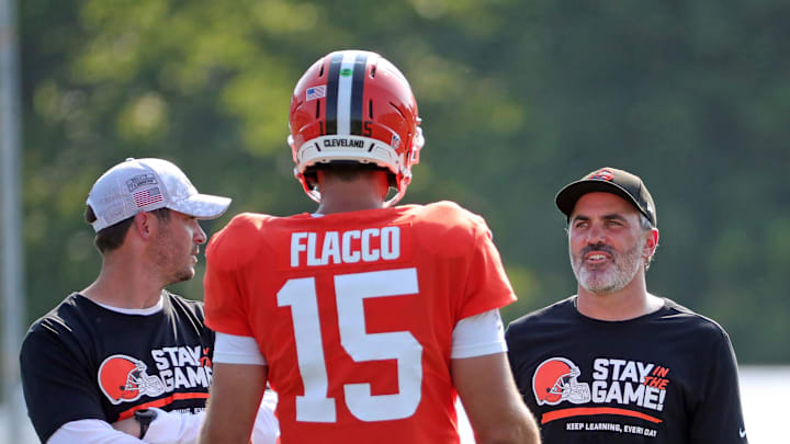 Cleveland Browns head coach Kevin Stefanski, facing, chats with quarterback Joe Flacco (15) during NFL training camp at CrossCountry Mortgage Campus, Wednesday, July 30, 2025, in Berea, Ohio. Cleveland Browns head coach Kevin Stefanski, facing, chats with quarterback Joe Flacco (15) during NFL training camp at CrossCountry Mortgage Campus, Wednesday, July 30, 2025, in Berea, Ohio.
