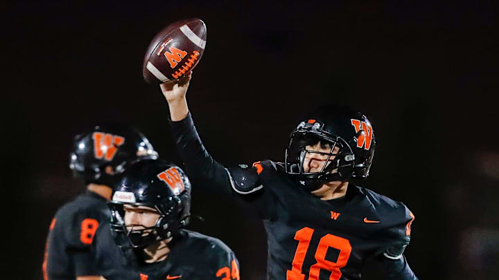 West De Pere High School's Maverick Lor (18) holds up the ball after recovering an onside kick against Bay Port High School on Friday, October 10, 2025, at West De Pere High School in De Pere, Wis. West De Pere won the game, 48-45, after trailing by 17 points with four minutes to play. Tork Mason/USA TODAY NETWORK-Wisconsin West De Pere High School's Maverick Lor (18) holds up the ball after recovering an onside kick against Bay Port High School on Friday, October 10, 2025, at West De Pere High School in De Pere, Wis. West De Pere won the game, 48-45, after trailing by 17 points with four minutes to play. Tork Mason/USA TODAY NETWORK-Wisconsin