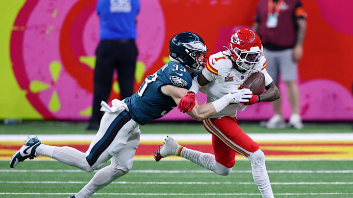Feb 9, 2025; New Orleans, LA, USA; Kansas City Chiefs wide receiver Xavier Worthy (1) runs with the ball against Philadelphia Eagles cornerback Cooper DeJean (33) during the first half of Super Bowl LIX at Caesars Superdome. Mandatory Credit: Bill Streicher-Imagn Images