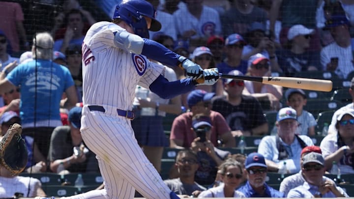 Jun 21, 2025; Chicago, Illinois, USA; Chicago Cubs outfielder Pete Crow-Armstrong (4) hits a home run against the Seattle Mariners during the fifth inning at Wrigley Field. 