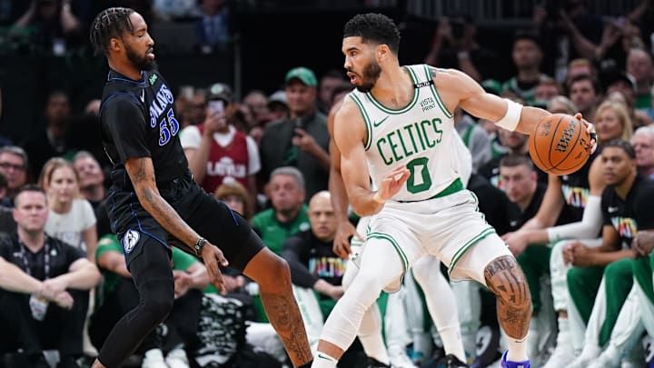 Boston Celtics forward Jayson Tatum (0) controls the ball.
