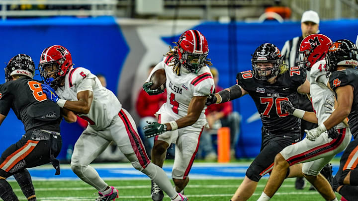 Orchard Lake St. Mary’s WR Bryson Williams (4) breaks through Byron Center’s defensive line during the first half of the Michigan High School Athletic Association division two football finals at Ford Field in Detroit on Friday, Nov. 29, 2024.
