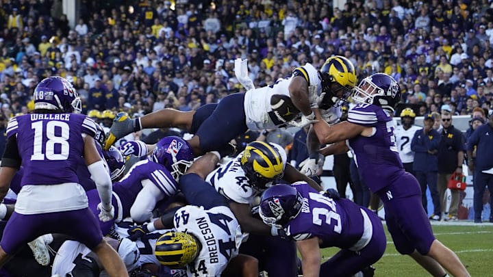 Nov 15, 2025; Chicago, Illinois, USA; Michigan Wolverines running back Jordan Marshall (23) runs for a touchdown against the Northwestern Wildcats during the second half at Wrigley Field. Mandatory Credit: David Banks-Imagn Images Nov 15, 2025; Chicago, Illinois, USA; Michigan Wolverines running back Jordan Marshall (23) runs for a touchdown against the Northwestern Wildcats during the second half at Wrigley Field. Mandatory Credit: David Banks-Imagn Images