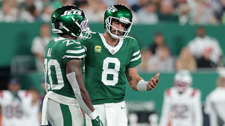 Aaron Rodgers and Breece Hall