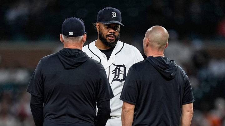 Detroit Tigers pitcher Kenley Jansen (74) talks to manager A.J. Hinch (14), left, and assistant athletic trainer Chris McDonald during the ninth inning against Los Angeles Angels at Comerica Park in Detroit on Wednesday, May 27, 2026.