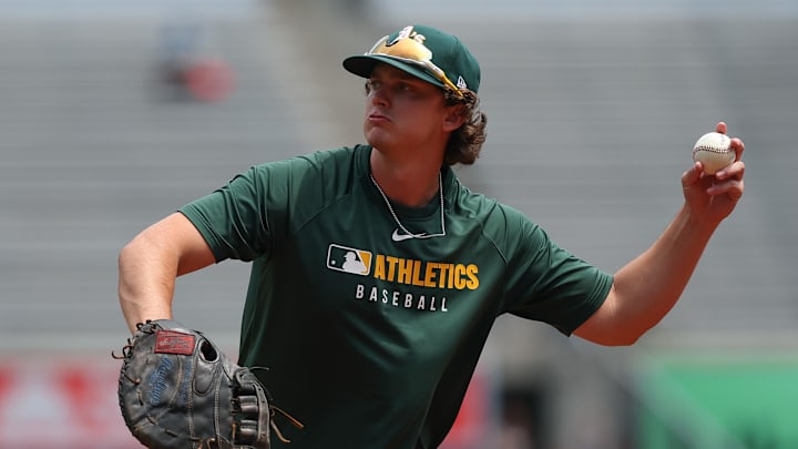 Jun 29, 2025; Bronx, New York, USA; Athletics first base Nick Kurtz (16) warms up before the game against the New York Yankees at Yankee Stadium. Mandatory Credit: Vincent Carchietta-Imagn Images
