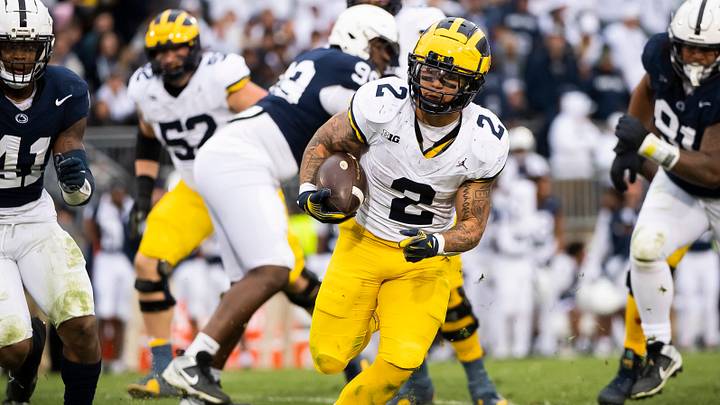 Michigan running back Blake Corum (2) takes off on a 30-yard touchdown run in the second half of an NCAA football game against Penn State Saturday, Nov. 11, 2023, in State College, Pa. Michigan running back Blake Corum (2) takes off on a 30-yard touchdown run in the second half of an NCAA football game against Penn State Saturday, Nov. 11, 2023, in State College, Pa.