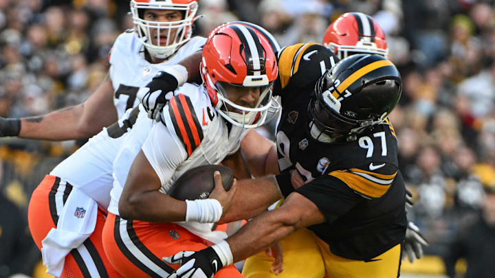 Dec 8, 2024; Pittsburgh, Pennsylvania, USA; Pittsburgh Steelers defensive tackle Cameron Heyward (97) sacks Cleveland Browns quarterback Jameis Winston (5) during the third quarter at Acrisure Stadium. Mandatory Credit: Barry Reeger-Imagn Images