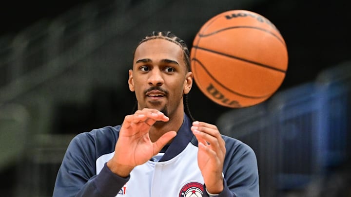 Dec 21, 2024; Milwaukee, Wisconsin, USA;  Washington Wizards center Alex Sarr (20) warms up before a game against the Milwaukee Bucks at Fiserv Forum. Mandatory Credit: Benny Sieu-Imagn Images
