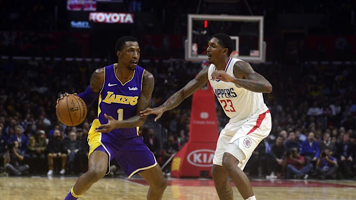 November 27, 2017; Los Angeles, CA, USA; Los Angeles Lakers guard Kentavious Caldwell-Pope (1) controls the ball against Los Angeles Clippers guard Lou Williams (23) during the second half at Staples Center. Mandatory Credit: Gary A. Vasquez-Imagn Images