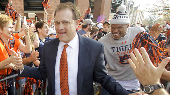 Nov 28, 2015; Auburn, AL, USA; Auburn Tigers head coach Gus Malzahn is followed by former Auburn Tigers player and current Carolina Panthers quarterback Cam Newton during Tiger Walk prior to the game against Alabama Crimson Tide at Jordan Hare Stadium. Mandatory Credit: John Reed-Imagn Images