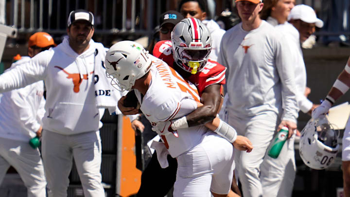 Ohio State Buckeyes safety Jaylen McClain (18) tackles Texas Longhorns quarterback Arch Manning (16) during the first half of the NCAA football game at Ohio Stadium on Aug. 30, 2025.