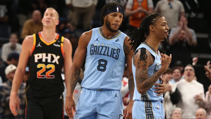 Mar 10, 2025; Memphis, Tennessee, USA; Memphis Grizzlies guard Ja Morant (12) reacts with forward Lamar Stevens (8) during the fourth quarter against the Phoenix Suns at FedExForum. Mandatory Credit: Petre Thomas-Imagn Images