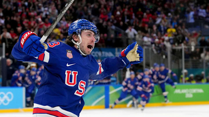 Feb 18, 2026; Milan, Italy; Quinn Hughes (43) of the United States celebrates his winning goal in overtime against Sweden in a men's ice hockey quarterfinal during the Milano Cortina 2026 Olympic Winter Games at Milano Santagiulia Ice Hockey Arena. Mandatory Credit: Amber Searls-Imagn Images