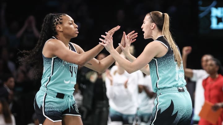 Jun 2, 2024; Brooklyn, New York, USA; New York Liberty forward Betnijah Laney-Hamilton (44) and guard Sabrina Ionescu (20) celebrate after the Indiana Fever call a timeout in the first quarter at Barclays Center. Mandatory Credit: Wendell Cruz-USA TODAY Sports Jun 2, 2024; Brooklyn, New York, USA; New York Liberty forward Betnijah Laney-Hamilton (44) and guard Sabrina Ionescu (20) celebrate after the Indiana Fever call a timeout in the first quarter at Barclays Center. Mandatory Credit: Wendell Cruz-USA TODAY Sports