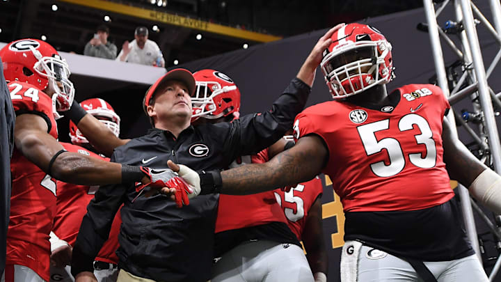 Georgia running back Prather Hudson (24), Georgia head coach Kirby Smart and Georgia center Lamont Gaillard (53) take the field before the College Football Playoff National Championship game between Georgia and Alabama on Monday, Jan. 8, 2017 in Atlanta, Ga. (AJ Reynolds for the Athens Banner-Herald)