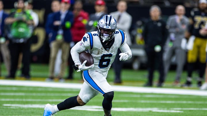 Dec 10, 2023; New Orleans, Louisiana, USA; Carolina Panthers running back Miles Sanders (6) catchers a pass against the New Orleans Saints during the second half at the Caesars Superdome. Mandatory Credit: Stephen Lew-USA TODAY Sports