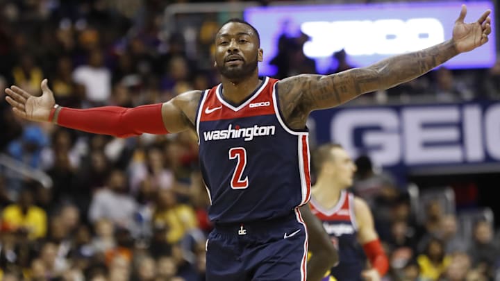 Dec 16, 2018; Washington, DC, USA; Washington Wizards guard John Wall (2) celebrates on the court against the Los Angeles Lakers in the third quarter at Capital One Arena.  The Wizards won 128-110. Mandatory Credit: Geoff Burke-Imagn Images