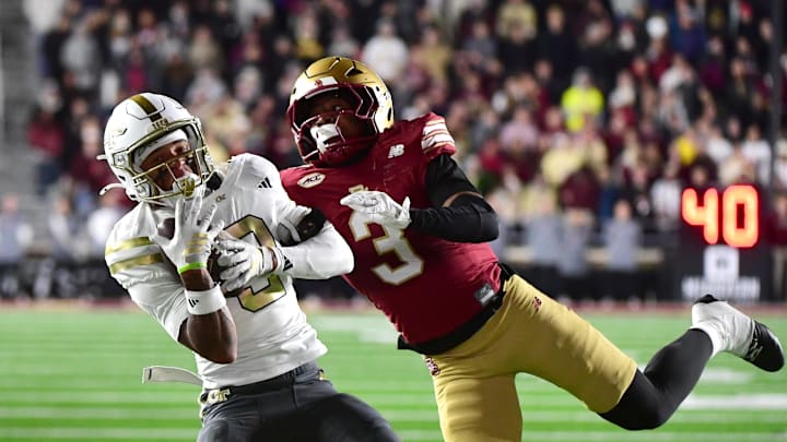 Nov 15, 2025; Chestnut Hill, Massachusetts, USA; Georgia Tech Yellow Jackets wide receiver Eric Rivers (3) makes a catch while being defended by Boston College Eagles defensive back Max Tucker (3) during the second half at Alumni Stadium. Mandatory Credit: Bob DeChiara-Imagn Images