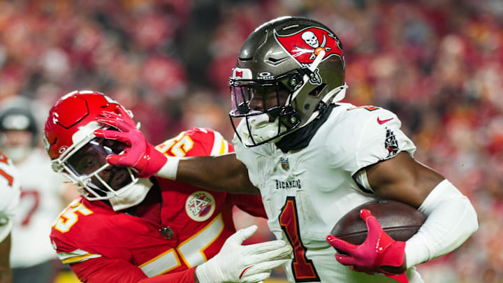 Tampa Bay Buccaneers running back Rachaad White (1) runs the ball against Kansas City Chiefs linebacker Joshua Uche (55) during the first half at GEHA Field at Arrowhead Stadium. 