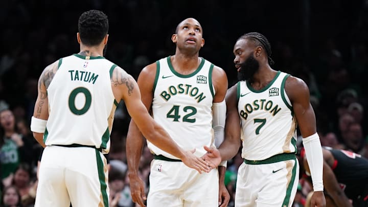 Nov 28, 2023; Boston, Massachusetts, USA; Boston Celtics guard Jaylen Brown (7) with forward Jayson Tatum (0) and center Al Horford (42) after his basket against the Chicago Bulls in the second half at TD Garden. Mandatory Credit: David Butler II-Imagn Images