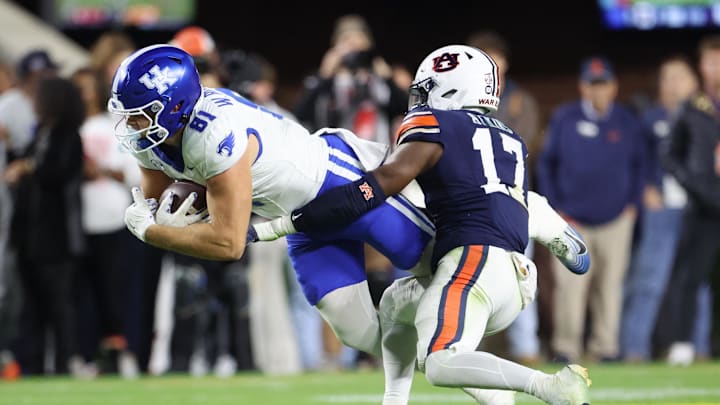 Nov 1, 2025; Auburn, Alabama, USA;  Kentucky Wildcats tight end Willie Rodriguez (81) is tackled by Auburn Tigers linebacker Xavier Atkins (17) during the second quarter at Jordan-Hare Stadium. Mandatory Credit: John Reed-Imagn Images