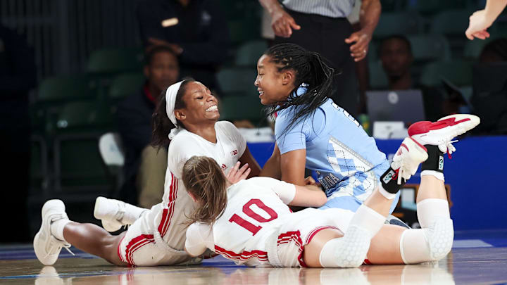 Nov 25, 2024; Paradise Island, Bahamas, BHS; Indiana Hoosiers guard Chloe Moore-McNeil (22) and Indiana Hoosiers guard Shay Ciezki (10) and North Carolina Tar Heels guard Grace Townsend (2) battle for a loose ball during the first half at the Atlantis Resort. 