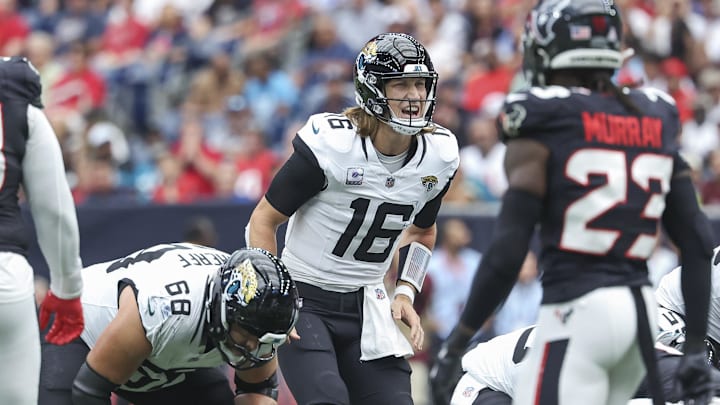 Sep 29, 2024; Houston, Texas, USA; Jacksonville Jaguars quarterback Trevor Lawrence (16) at the line of scrimmage during the second quarter against the Houston Texans at NRG Stadium. Mandatory Credit: Troy Taormina-Imagn Images