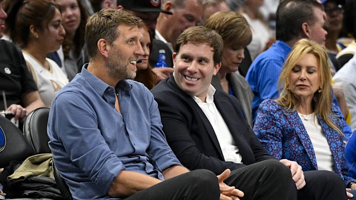 Dirk Nowitzki and Dallas Mavericks governor Patrick Dumont during the game between the Dallas Mavericks and the Golden State Warriors.