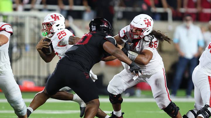 Houston Cougars defensive lineman McKenzie Angello blocks Texas Tech DT A.J.Holmes Jr. in the second half at Galaxy Stadium. Mandatory Credit: Michael C. Johnson-Imagn Images Houston Cougars defensive lineman McKenzie Angello blocks Texas Tech DT A.J.Holmes Jr. in the second half at Galaxy Stadium. Mandatory Credit: Michael C. Johnson-Imagn Images