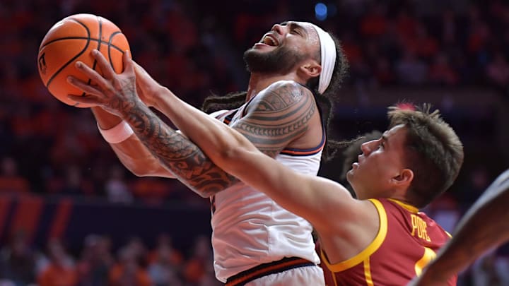Jan 11, 2025; Champaign, Illinois, USA;  Illinois Fighting Illini guard Kylan Boswell (4) drives to the basket as USC Trojans guard Bryce Pope (4) defends during the first half at State Farm Center. Mandatory Credit: Ron Johnson-Imagn Images