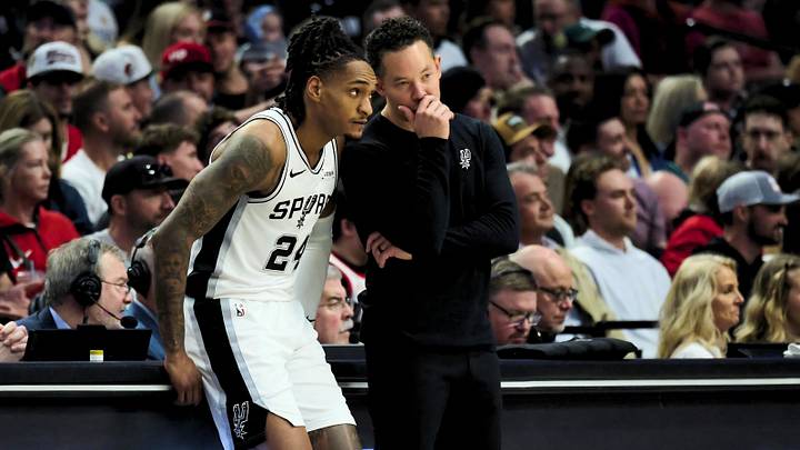 Apr 26, 2026; Portland, Oregon, USA; San Antonio Spurs coach Mitch Johnson talks with guard Devin Vassell (24) during the first half against the Portland Trail Blazers during Game 4 of the first round of the 2026 NBA Playoffs at Moda Center.