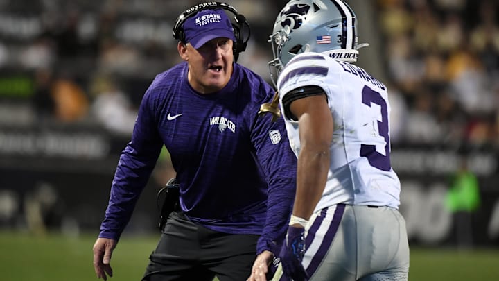 Kansas State's Chris Klieman talks to running back Dylan Edwards (3) in a game against the Colorado Buffaloes on Saturday, Oct. 12, 2024 in Boulder, Colo. at Folsom Field. Mandatory Credit: Christopher Hanewinckel-Imagn Images