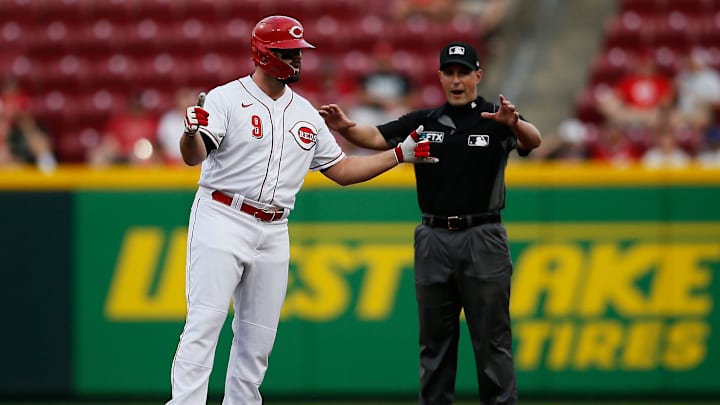 Cincinnati Reds designated hitter Mike Moustakas celebrates at second base after hitting a double.