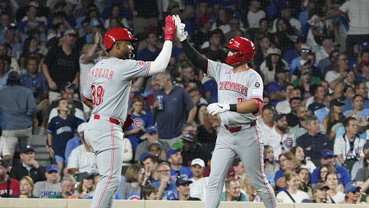Aug 5, 2025; Chicago, Illinois, USA;  Cincinnati Reds first base Spencer Steer (7) celebrates with outfielder Miguel Andujar (38) after hitting a home run during the seventh inning against the Chicago Cubs at Wrigley Field. Mandatory Credit: David Banks-Imagn Images