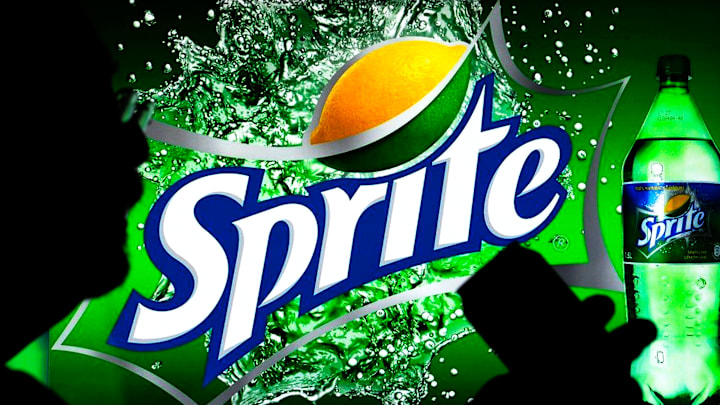 In this photo illustration, a Sprite logo seen displayed on...