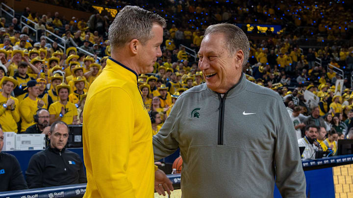 Michigan State’s Tom Izzo smiles as he greets Michigan’s Dusty May before their rivalry matchup game at Crisler Center in Ann Arbor, on Friday, Feb. 21, 2025.