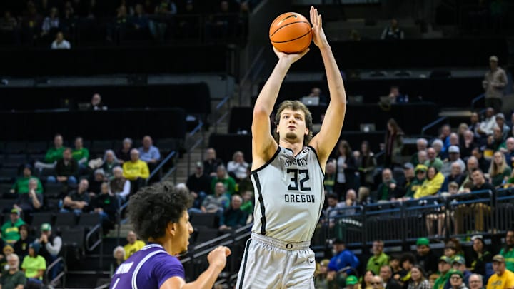 Dec 15, 2024; Eugene, Oregon, USA;  Oregon Ducks center Nate Bittle (32) shoots a jump shot during the first half against the Stephen F. Austin Lumberjacks at Matthew Knight Arena.
