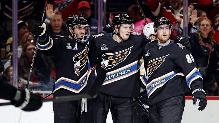Dec 31, 2024; Washington, District of Columbia, USA; Washington Capitals center Aliaksei Protas (21) celebrates after scoring a goal during the first period against the Boston Bruins at Capital One Arena. Mandatory Credit: Peter Casey-Imagn Images